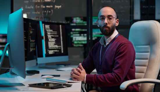 Person working on Terraform infrastructure code with cloud architecture diagram in the background, 2025