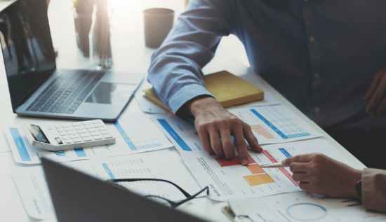 Illustration of a professional data modeler analyzing database schemas, surrounded by icons representing skills, certifications, and training courses.