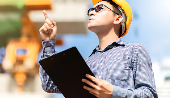 Technical architect working on system design with cloud infrastructure diagram, showcasing key skills and career development path in IT architecture.