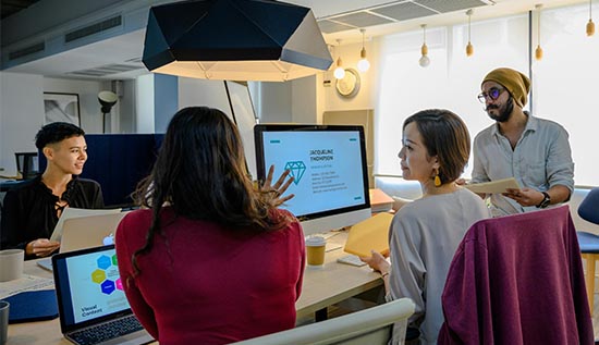 React developer working on a laptop with job listings on screen, highlighting top React job opportunities in 2025.