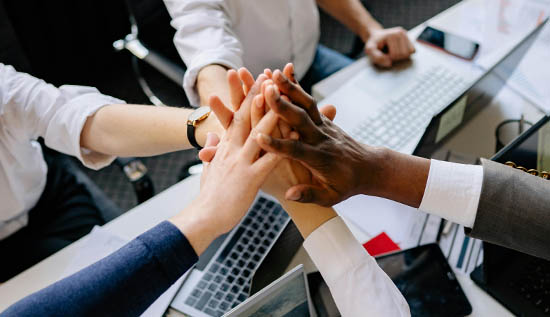 Group of people solving problems through teamwork and collaboration.