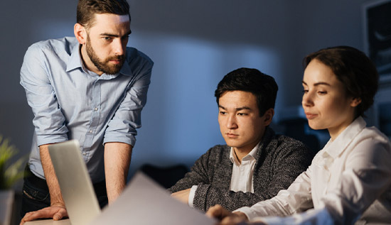 Team of IT professionals collaborating on a project, showcasing skills like communication, problem-solving, and technical expertise.