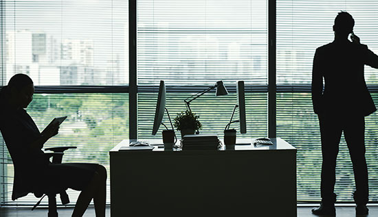 Employee using unauthorized software on work computer representing shadow IT risks in the workplace