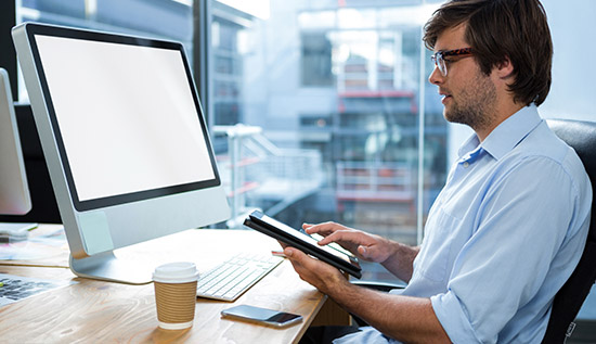 A digital workspace with remote employees collaborating via cloud-based tools, enhancing productivity and reducing office costs.