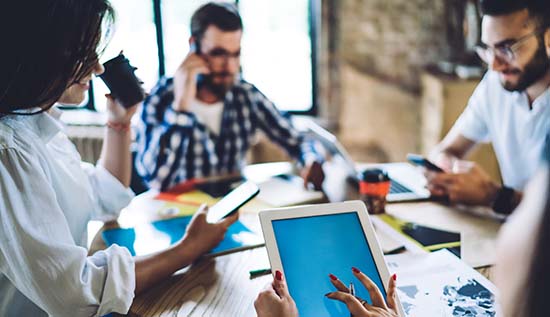 Digital communication tools like email and chat boosting office productivity.