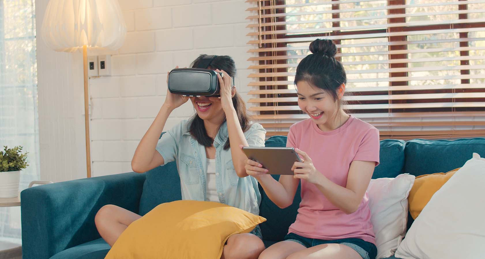 An Asian couple using a tablet, experiencing the impactful benefits of modern technology