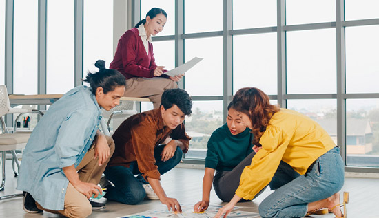 IT team brainstorming and collaborating, representing the foundation of building a strong and cohesive team